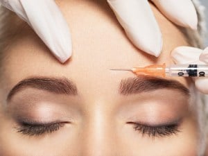 woman receiving dermal filler injection