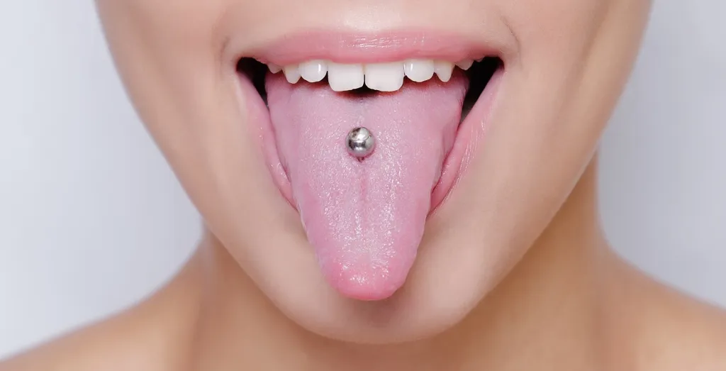 mouth with pierced tongue sticking out
