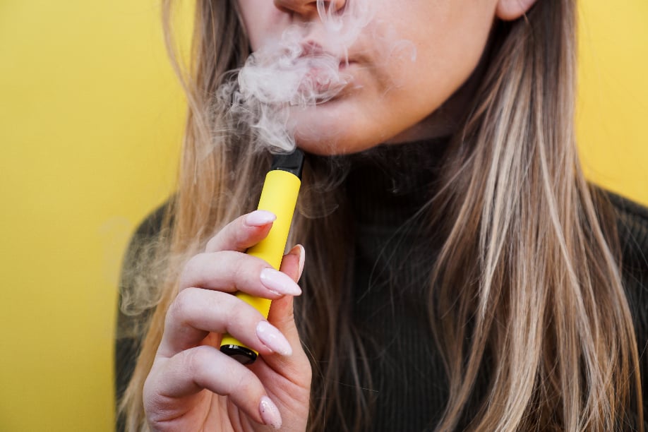 young blonde woman holding nail file